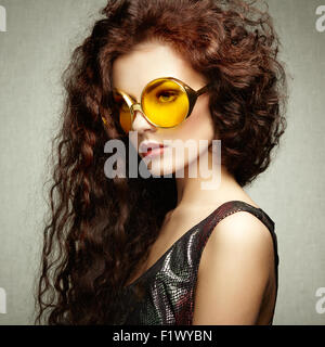 Portrait of beautiful woman in sunglasses on white background. Fashion photo Stock Photo