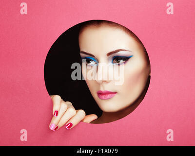 Conceptual beauty portrait of beautiful young woman. Perfect Manicure.  Cosmetic Eyeshadows. Fashion photo Stock Photo