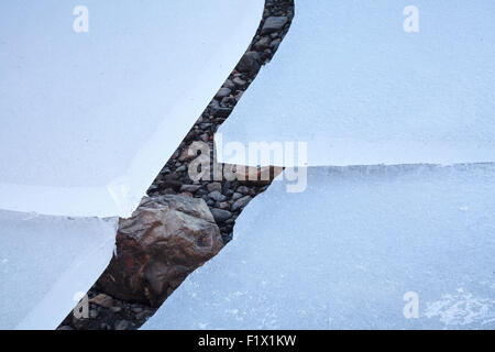 Stone frozen in ice. Vatnajokull National Park. Iceland. Stock Photo