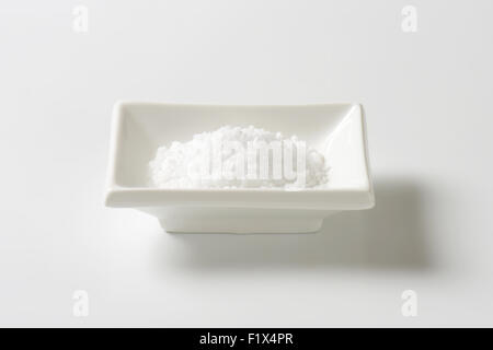 coarse ground salt in white rectangular bowl Stock Photo