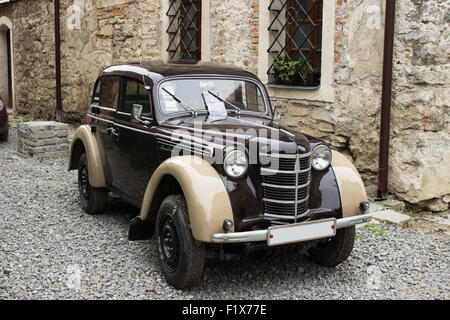 retro car Moskvitch on the stone pavers. Stock Photo