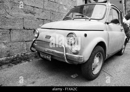 Lacco Ameno, Italy - August 15, 2015: Old Fiat Nuova 500 city car produced by the Italian manufacturer Fiat between 1957 and 197 Stock Photo