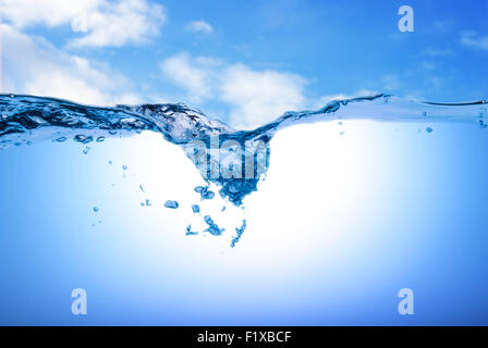 Water and air bubbles over sky background. Stock Photo