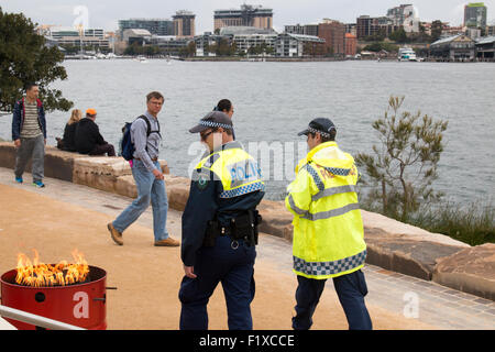 new south wales police officers on patrol in Barangaroo reserve park,Sydney,Australia Stock Photo