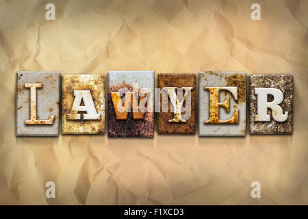 The word 'LAWYER' written in rusty metal letterpress type on a crumbled aged paper background. Stock Photo