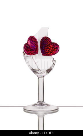broken glass with two hearts. Stock Photo