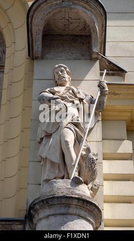 Saint John the Evangelist on the portal of Saint James church in Ljubljana, Slovenia Stock Photo