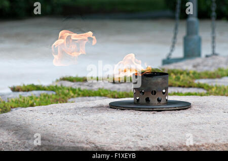 The eternal flame marking the gravesite of President John F. Kennedy at Arlington National Cemetery on his birthday May 29, 2015 in Arlington, Virginia. Stock Photo