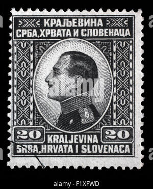 Stamp printed in Yugoslavia (Kingdom Serbia, Croatia and Slovenia) shows portrait of King Alexander I, circa 1924 Stock Photo