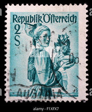 Stamp printed in the Austria shows Woman from Upper Austria, Regional Costume, circa 1948 Stock Photo