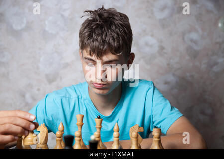 Portrait of teenager playing chess Stock Photo