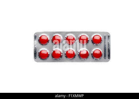 Red pills in blister pack isolated on white background Stock Photo