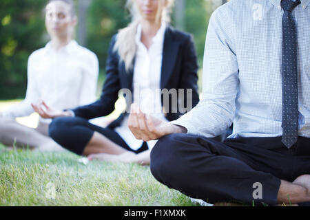 business people doing yoga Stock Photo