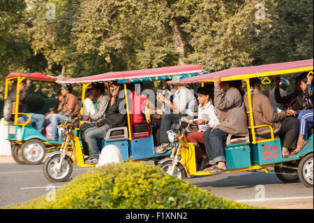 Delhi, India. Three crowded motorized auto rickshaws. Stock Photo