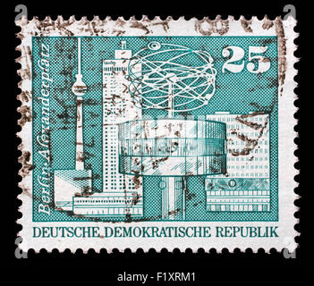 Stamp printed in GDR shows World Clock, Alexander Square, Berlin, circa 1973 Stock Photo