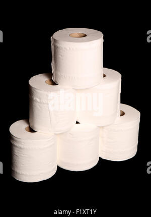 stack of toilet paper rolls on black background Stock Photo
