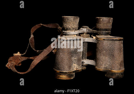 dirty old pair of binoculars on black background Stock Photo