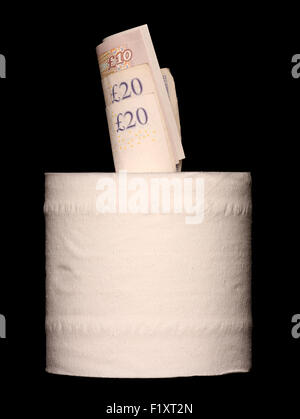 Money inside a toilet roll on black background Stock Photo