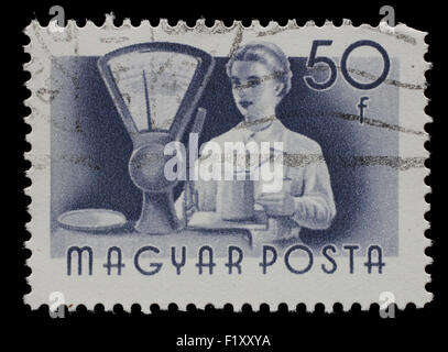 HUNGARY - CIRCA 1955: A stamp printed in Hungary, shows seller, series occupations, circa 1955 Stock Photo
