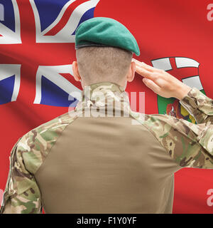 Soldier saluting to Canadial province flag series - Manitoba Stock Photo