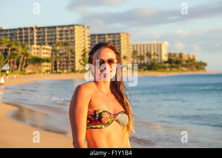 Woman at Kaanapali Beach on Maui at sunset Stock Photo