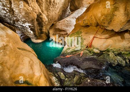 Oman, Wadi Shab, waterfall in the cave at the end of the canyon Stock