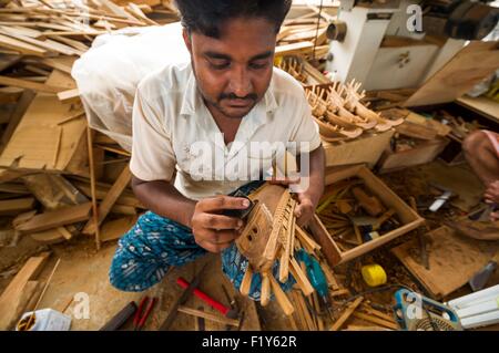 Oman, Sur, marine museum, naval factory of dhow, indian workers manufacturing scale models for tourists Stock Photo