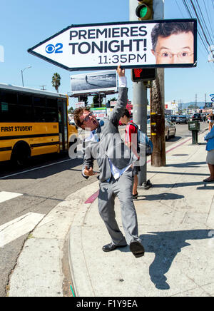 Los Angeles, California, USA. 08th Sep, 2015. AArow Advertising sign spinner KOREY MENDENHALL calls attention to the premiere tonight of The Late Show with Stephen Colbert. Credit:  Brian Cahn/ZUMA Wire/Alamy Live News Stock Photo
