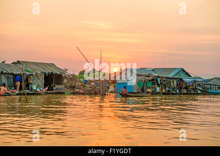 woman on a boat in the floating village near Kompong Chnang in Cambodia Stock Photo
