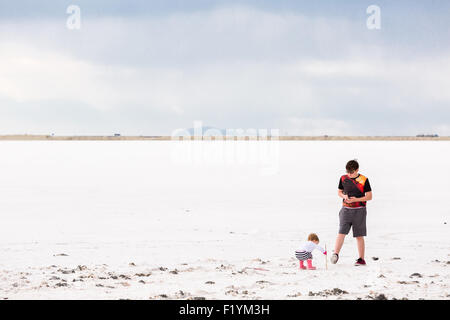 Toddler girl playing at Bonneville Salt Flats. Stock Photo