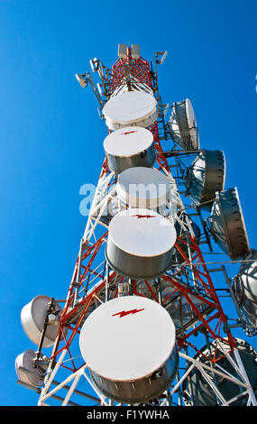 Modern cell and antenna with flat parabola on blue sky Stock Photo