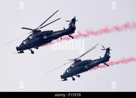Tianjin, China. 9th Sep, 2015. Gunships perform at the opening ceremony of the Tianjin International Helicopter Exhibition in a helicopter base of Aviation Industry Corporation of China in the Airport Area of China Pilot Free Trade Zone of Tianjin, north China, north China, Sept. 9, 2015. The exhibition displayed 56 helicopters and attracted 366 enterprises. Credit:  Zhang Chenlin/Xinhua/Alamy Live News Stock Photo