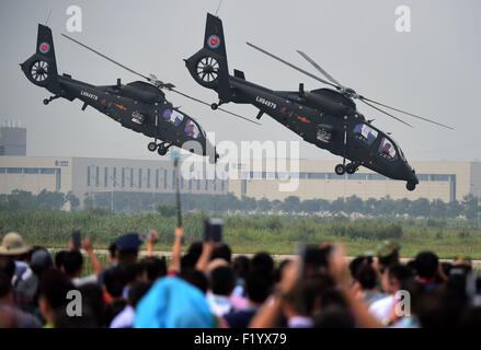 Tianjin, China. 9th Sep, 2015. Gunships perform at the opening ceremony of the Tianjin International Helicopter Exhibition in a helicopter base of Aviation Industry Corporation of China in the Airport Area of China Pilot Free Trade Zone of Tianjin, north China, north China, Sept. 9, 2015. The exhibition displayed 56 helicopters and attracted 366 enterprises. Credit:  Zhang Chenlin/Xinhua/Alamy Live News Stock Photo