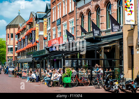 People sitting at outdoors restaurant in the main square of Eindhoven Stock Photo