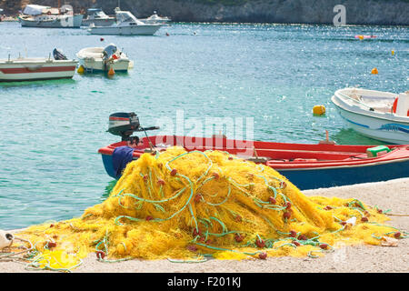 Yellow fishing nets and boat Stock Photo