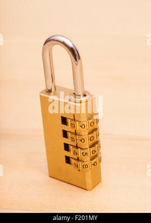 combination lock on wooden background Stock Photo