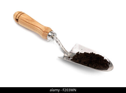 soil with garden trowel isolated on a white background Stock Photo