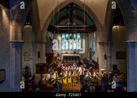 A Local Band Plays Music In St Andrew's Church In Alfriston During The Annual Village Fete, Alfriston, East Sussex, UK Stock Photo