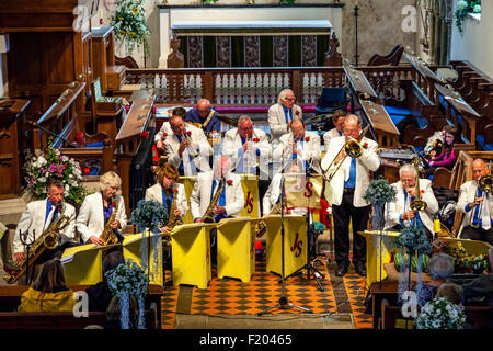 A Local Band Plays Music In St Andrew's Church In Alfriston During The Annual Village Fete, Alfriston, East Sussex, UK Stock Photo