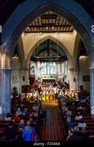 A Local Band Plays Music In St Andrew's Church In Alfriston During The Annual Village Fete, Alfriston, East Sussex, UK Stock Photo