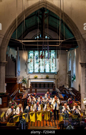 A Local Band Plays Music In St Andrew's Church In Alfriston During The Annual Village Fete, Alfriston, East Sussex, UK Stock Photo