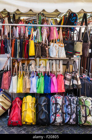 Leather bags purses handbags wallets on market stall Rome Italy