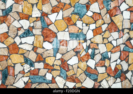 Colorful stone mosaic with chaotic pattern, background photo texture Stock Photo