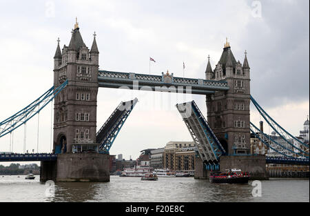 London, Britain. 9th Sep, 2015. A flotilla of historic vessels, leisure cruisers and passenger boats pass under the Tower Bridge in a procession on the River Thames to mark the day on which Queen Elizabeth II becomes the longest reigning monarch in British history, in London, Britain, on Sept. 9, 2015. Wednesday marks the 63 years and 216 days since the Queen came to the throne. The procession began from east of Tower Bridge at midday, with the vessels sounding their horns for one minute. Also, the Tower Bridge lifted as a sign of respect. Credit:  Han Yan/Xinhua/Alamy Live News Stock Photo