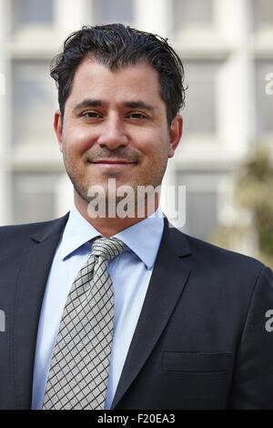 Portrait of mid adult business man, looking at camera, smiling Stock Photo