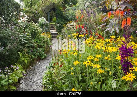 Poppy Cottage Garden on Roseland Peninsula in Cornwall Stock Photo