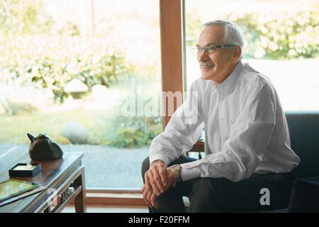 Senior man at home, relaxing Stock Photo