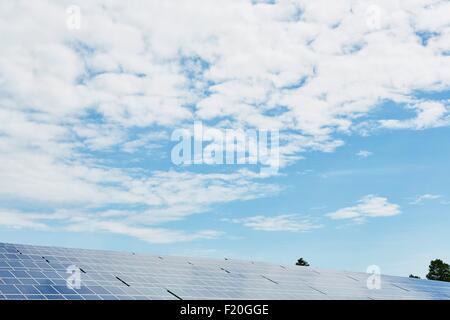 Solar panels against blue sky and clouds Stock Photo