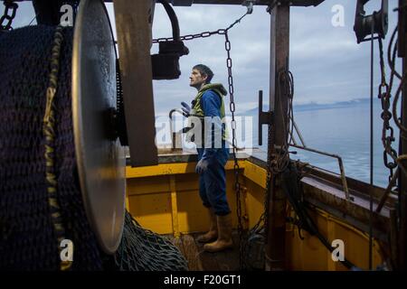 Fisherman preparing trawler Stock Photo