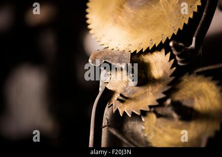 Brass cogs on old weaving machine in textile mill Stock Photo
